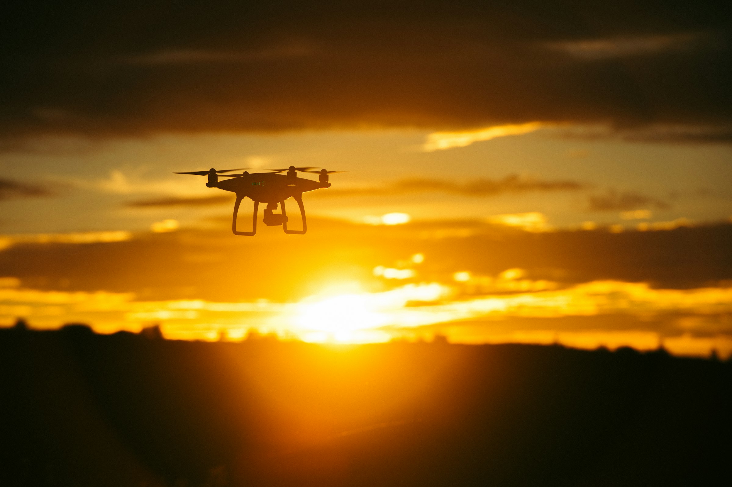 A drone in flight against an open sky